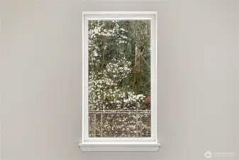 Pretty view of blooming trees and conifers from upstiars landing.