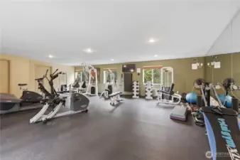 Gym is on top floor of community building. Building to right as you enter complex. Access around community building to the left and up walkway. Across from hot tub.