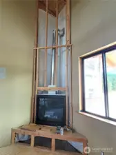 This floor to ceiling fireplace rock work will match the outside rock wainscotting when it is completed.