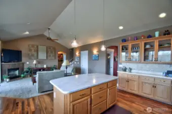 Kitchen view into the living room with fireplace