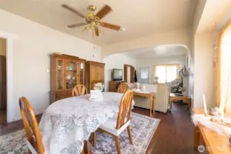 Dining area flows seamlessly from the living space, offering a versatile spot for gatherings.