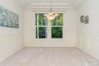 The formal dining room faces the greenbelt view!