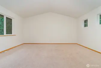 Upstairs Bonus room with a vaulted ceiling & ample space for the pool table.