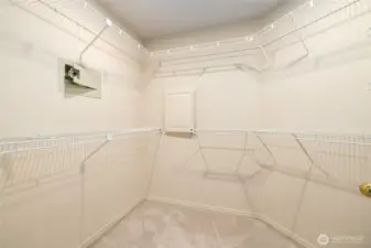 Primary Bedroom Walk in Closet with Laundry Shoot