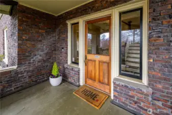 Large, covered front porch leads into the formal entry.