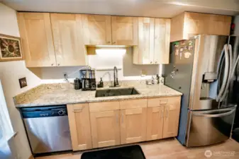 Newer cabinets, stainless appliances, double sink. Owner will remove refrigerator as to big for that spot.
