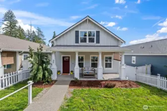 Main level living, with additional living space and bedrooms upstairs.
