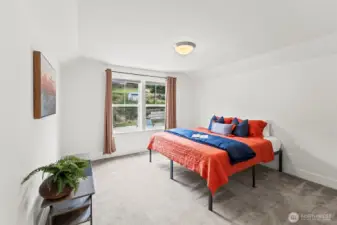 Upstairs bedroom #3 looks over the front yard and the open meadow across