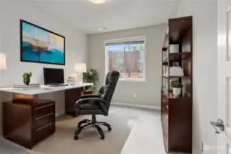 Bedroom on the main level, converted as home office (virtually staged)