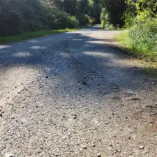 Nice gravel road. Windsun Way. Only 3 neighbors beyond this parcel. Low traffic.