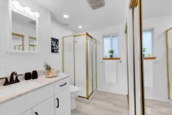 Double closets and updated vanity in primary bath