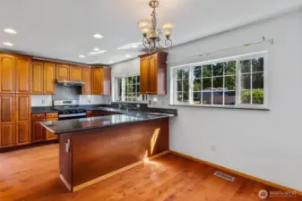 An abundance of cabinets and granite counters