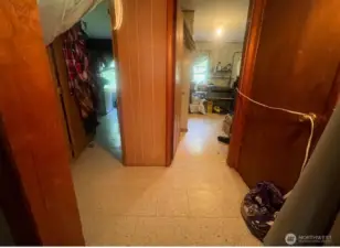 Hallway leading to master bedroom and laundry room. Bathroom is to the left.