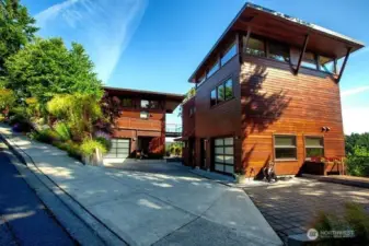 Detached Guest House apartment with single car garage. Apartment on 2nd level and office/Flex room on ground level. Parking area have stone pavers.