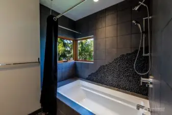 Guest bedroom has a full bath, custom designed.