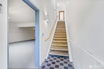 Main entry - stairs up to office space with bathroom.