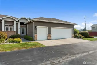 Spacious double garage and separated smaller bay for golf cart, hobbies, sports equipent.