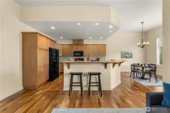 Cabinets have pull outs with high quality appliances and spacious dining area