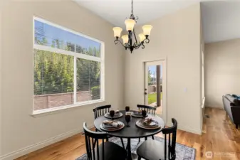 Dining has glass door to eastern patio.