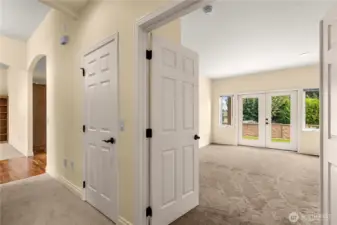 Double French doors to primary bedroom has French doors to patio.