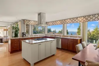 Updated kitchen with center island and stainless appliances.