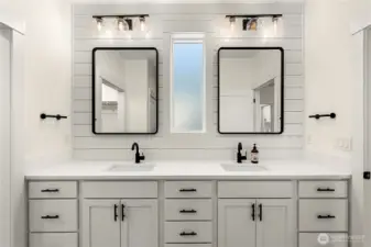 Double Vanity. Custom cabinets and quarts counter tops with striking hardware.