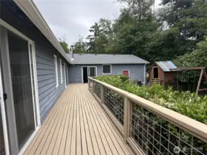 Deck with doors to master bedroom, dining room and living room