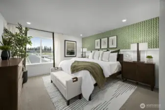 Primary bedroom of model home. Finishes and features may vary.
