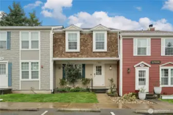 Carriage Row-One of the most unique condominium complex's.  Townhome-style. This unit is 3 level with a total of 1588 sf. 3 bedrooms upstairs with full bath. Main level perfectly sized living area with wood burning insert fireplace, dining area, refreshed kitchen cabinets painted and baseboards. Main level deck.  Downstairs large family room with projector and screen-stays + extra finished room-currently workout room.