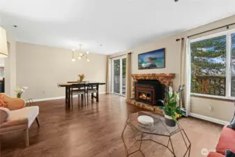 Living and dining with access to full length deck. Newer laminate flooring.  Wood stove.  Last special assessment-New roof, siding, windows, sliding glass doors, exterior painting, trex-type decking.