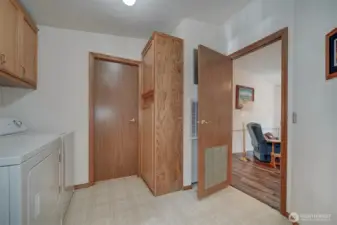 A great location for the spacious laundry room. The closed door leads to the main/guest bathroom the open door leads to the family room.