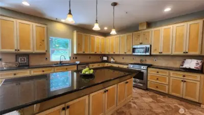 The kitchen offers tons of storage.