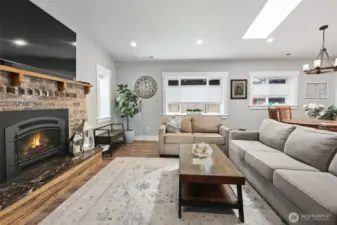 Vaulted ceilings with skylights and plenty of windows fill the main living spaces with natural light.