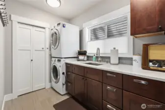 Utility room provides indoor storage and plenty of space for laundry & folding clothes.