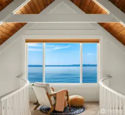 The captain's bridge overlooks the lower level from the landing adjacent to the loft bedroom. Watch the ferries and ships sail past from this perch. Be on the lookout for orca, seals, eagles and more. Imagine this as your home office!