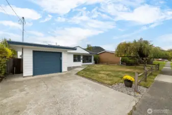 There is an attached single car garage in the front of the house and a large detached RV garage in the back.