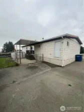 Covered back porch and patio. And more parking!