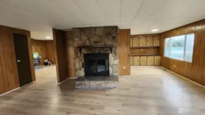 Walk into large open livingroom with wood burning fireplace!
