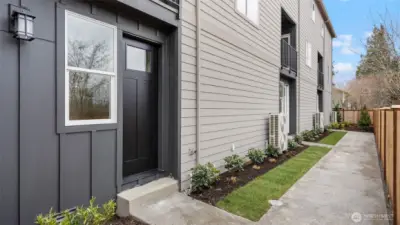 Exterior Rear is fenced and landscaped.