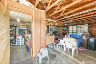 Extra office/storage area in 2-car garage with shop table which stays
