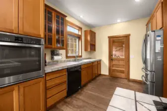 Kitchen with door looking out into the stall and breezeway area.
