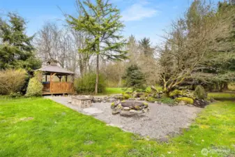 Hot tub area behind house.