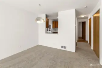 Looking from the deck to the dining area and open concept kitchen.