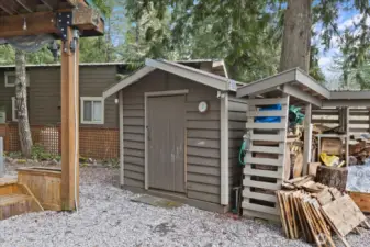 Shed and woodshed with firewood as well as wood for your projects