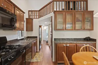 Kitchen, dining room with extra storage cabinets. And a loft!