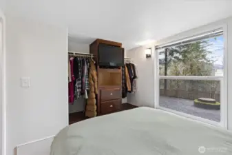 Main bedroom has a view of the ravine and back yard firepit.