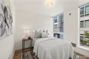 3rd bedroom on the North side of the home also has floor to ceiling windows and hardwood floors.