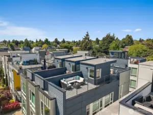 Large rooftop deck with sweeping views has two areas to enjoy.