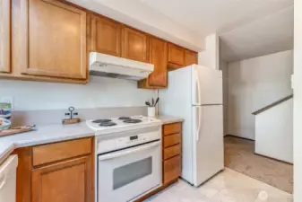 Kitchen has lots of cabinets and counter space.