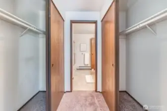 These dual closets are located between the primary bedroom and the second floor bathroom.